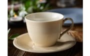 Kaffeeuntertasse Color Loop aus Porzellan in sand